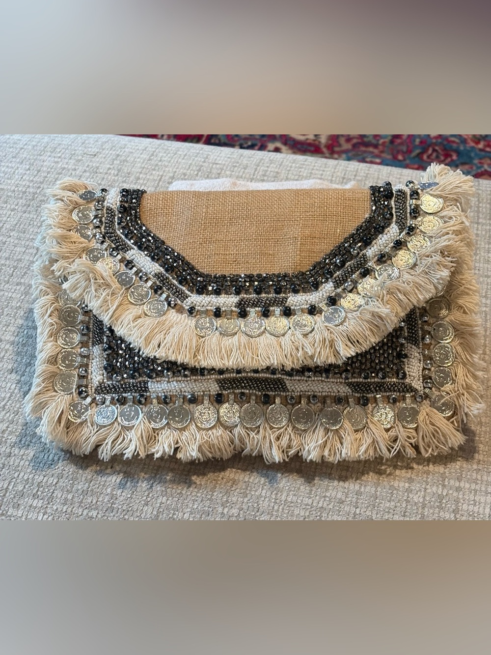 Lulu’s beaded fringe coin envelope clutch.